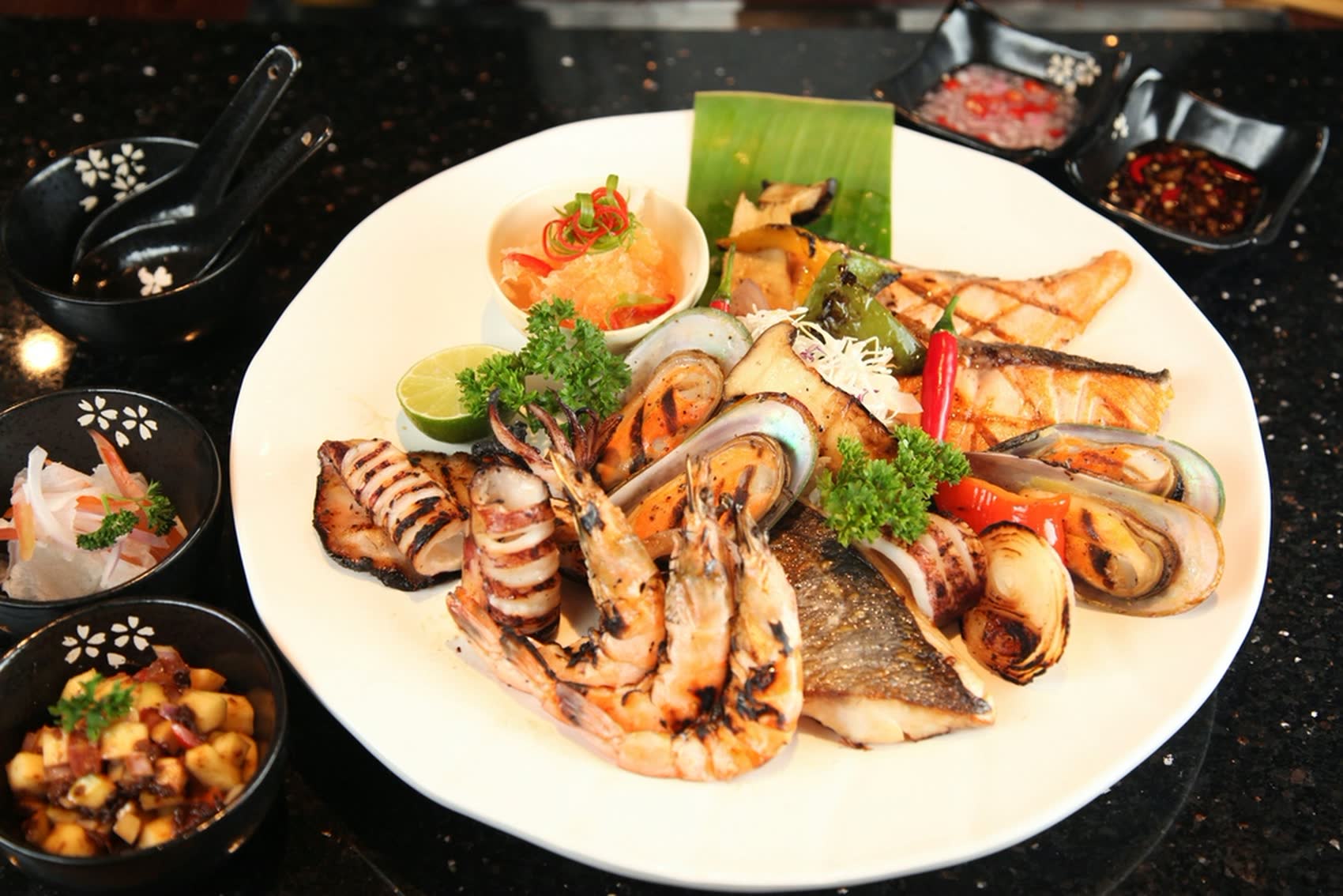 Grilled Andaman seafood platter with prawns, squid, mussels and sea bass at Mali Restaurant Khao Lak